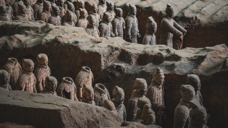 Explore the iconic Terracotta Army in Xi'an, showcasing ancient Chinese sculptures of warriors and horses. Captured in detail.